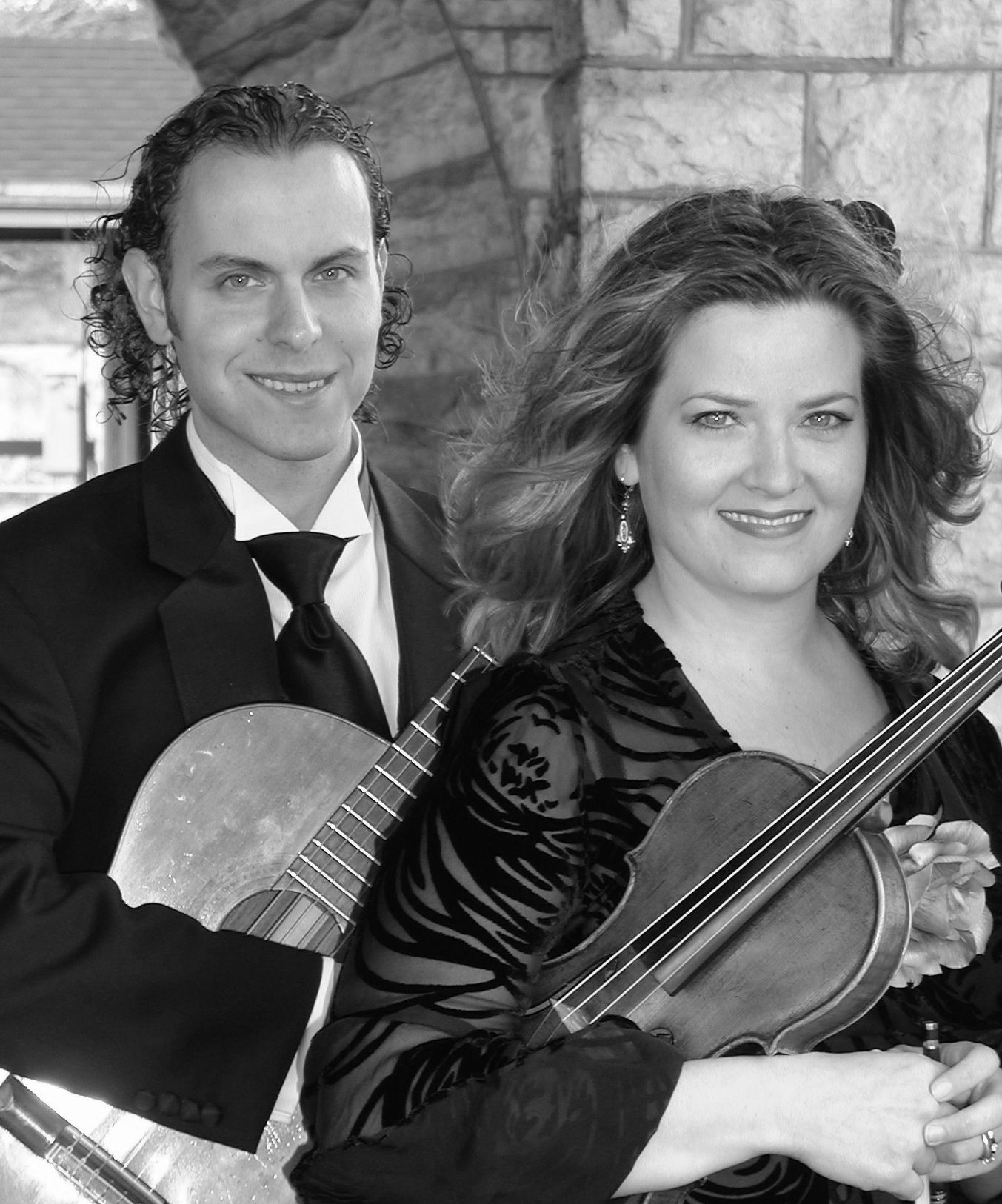 Sherri and Jason Deroche with violin and guitar